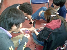Thai university students building a Lollybot