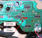 Track side of the main PCB showing the Orange solder point and hole location