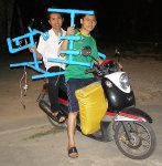 Carrying the PVC car home on a motorcycle!