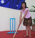 A Thai university students playing cricket with a PVC cricket wicket