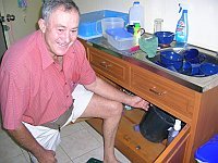 My Dad plumbing our kitchen sink