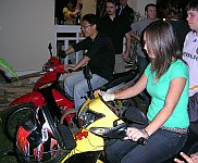 Two Payap University students playing GL-Tron on real motorbikes