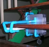 Data projector mounted beneath the stairs in a PVC water pipe cage