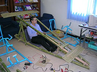 Test driving a bamboo racing car.