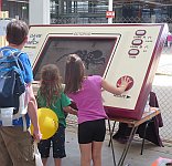 Kids playing the giant Game & Watch game at maker Faire Adelaide