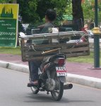 Glazier riding a motorbike