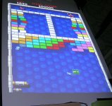 Playing Arkanoid on the Plasma Pong table