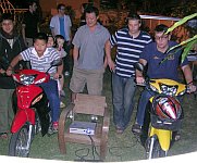 Father and son playing GL-Tron using real motorbikes