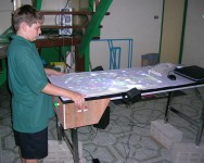 My son playing Future Pinball in portrait projection mode with the table standing on bricks.